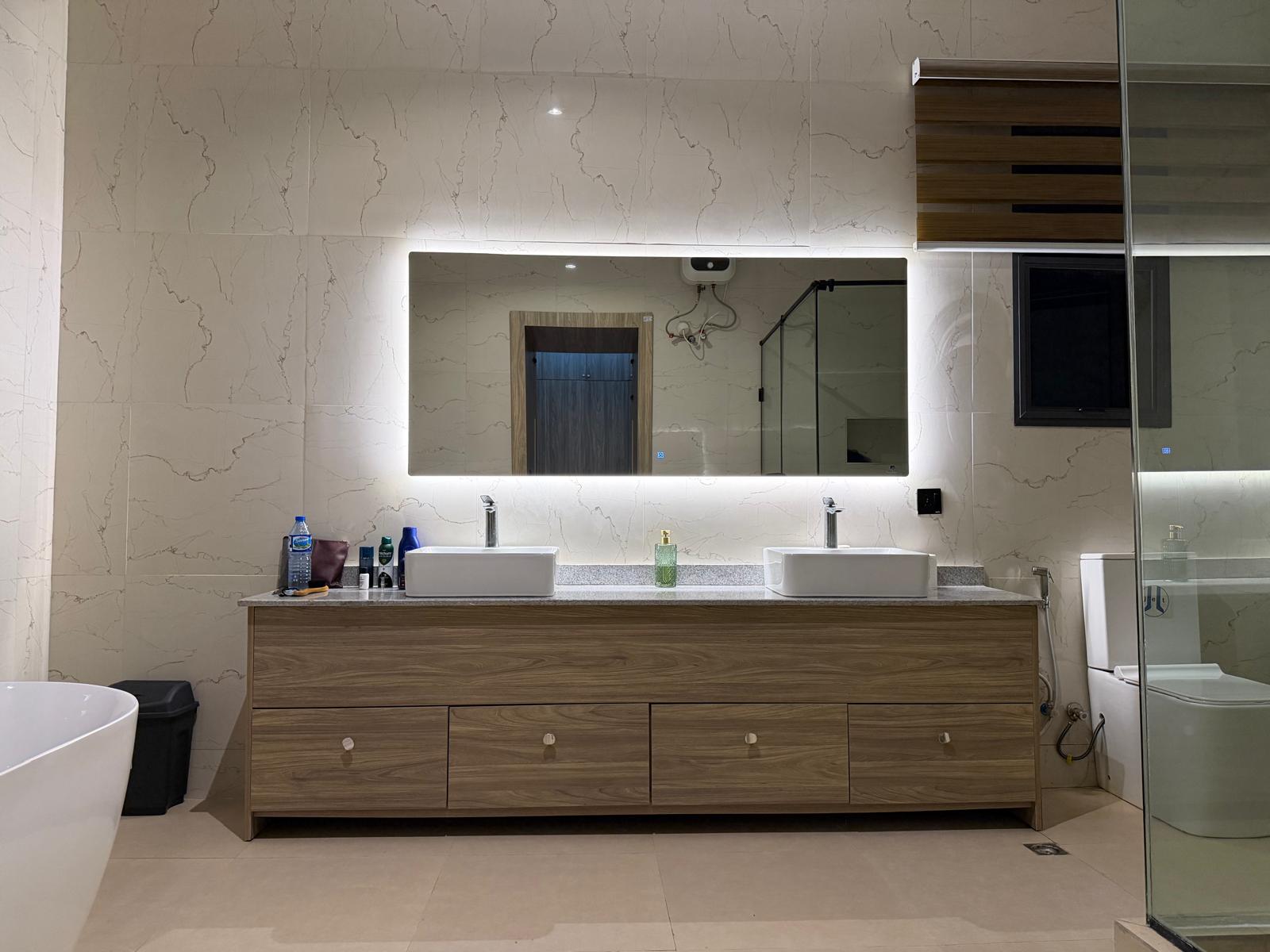 Double vanity with backlit mirror