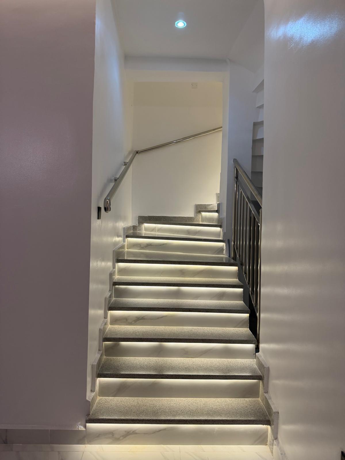 Lit staircase connecting the two living levels